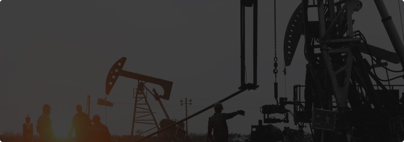 Pumpjacks on an oil field at dusk